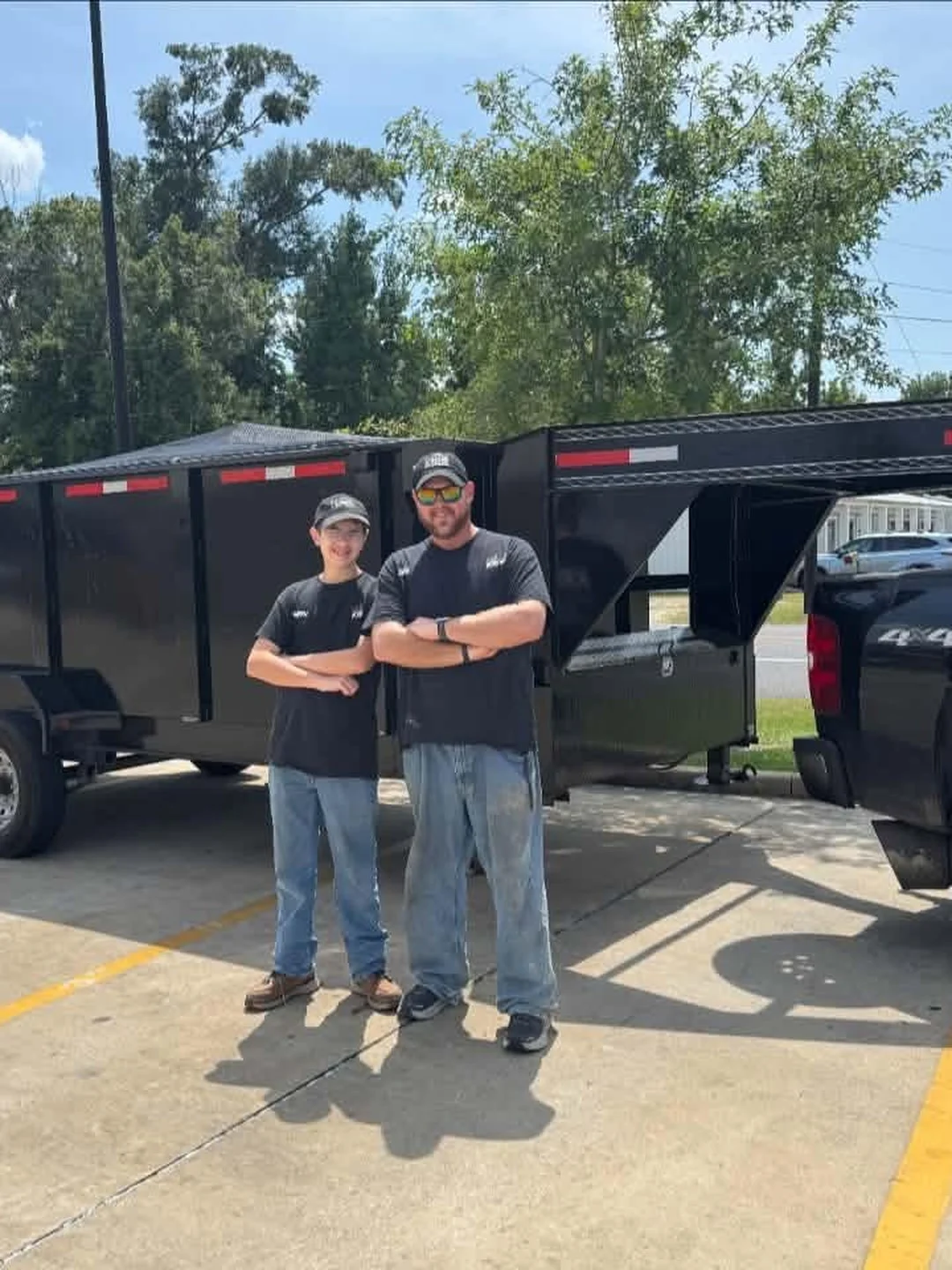 The Klutter Krewe crew with their truck and dump trailer