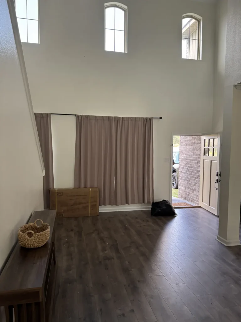 The same living room cleared and swept after the cleanout