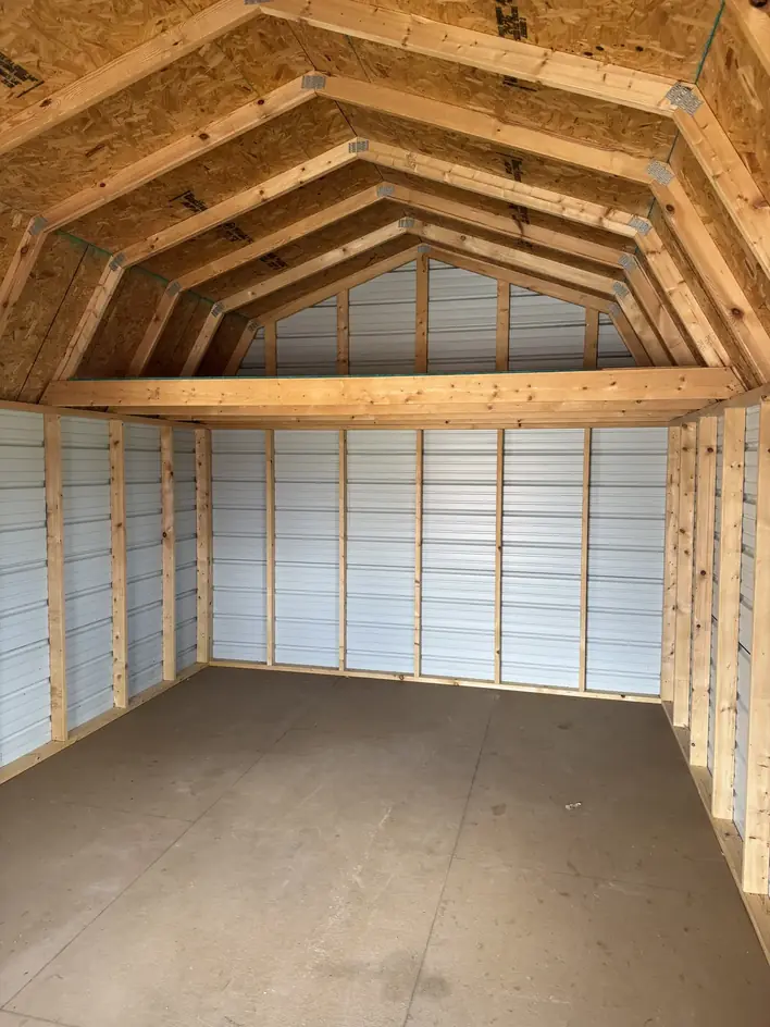 The same storage building emptied and swept to bare walls and floor