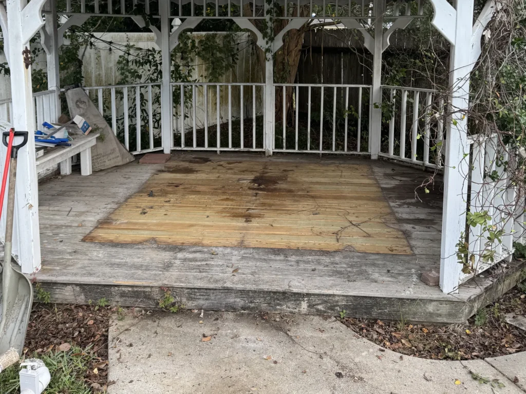 The same Rayne gazebo with the hot tub gone and the empty deck floor where it sat