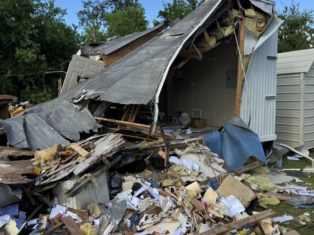 The Westlake office building partly torn down with debris piled beside it